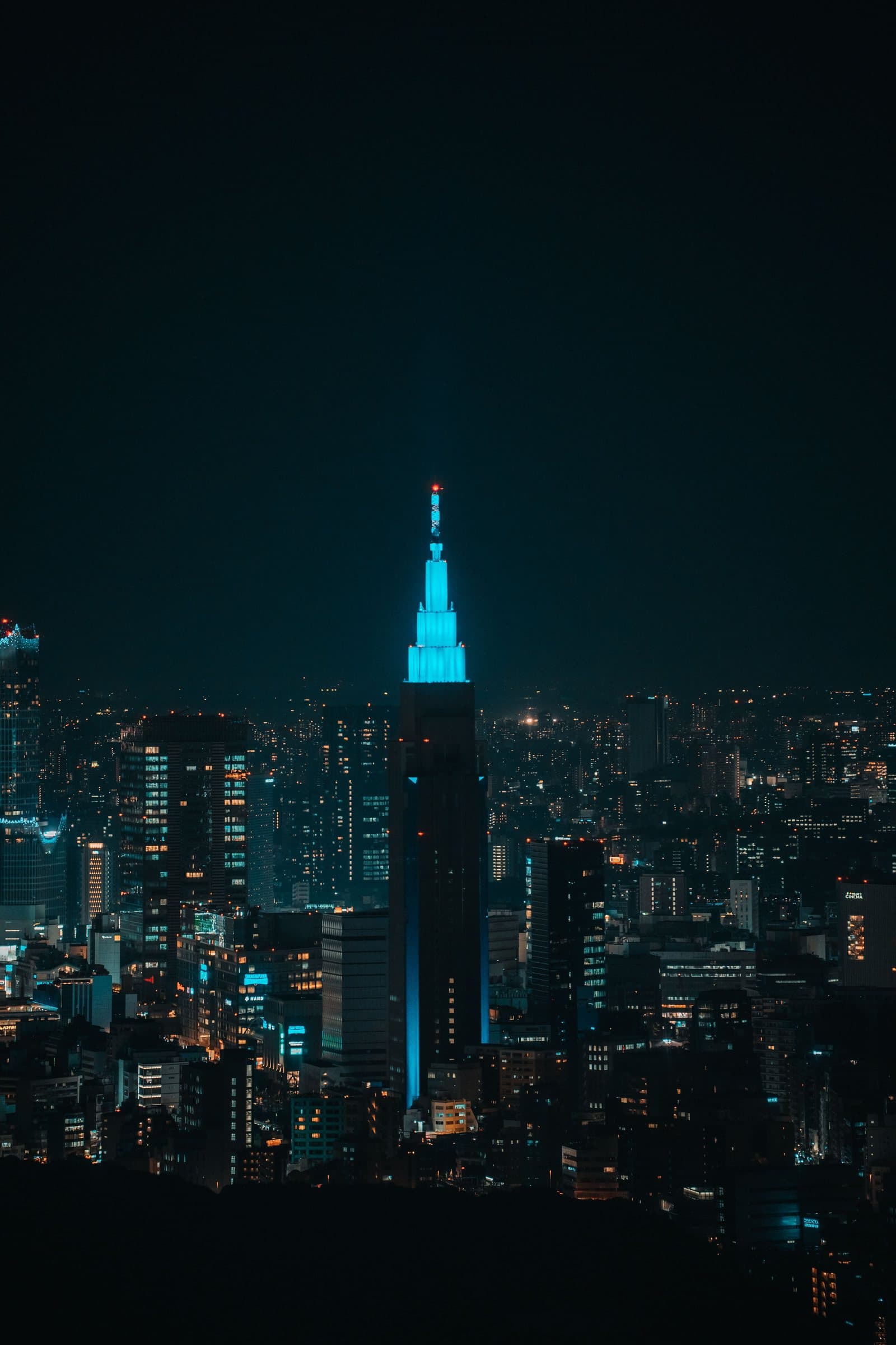 A city skyline at night — Vellora Escapes